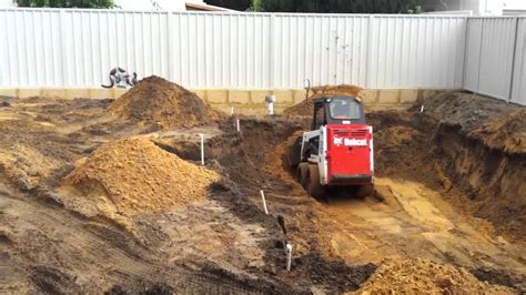 how to dig a pool with a skid steer|how to dig a deep pool.